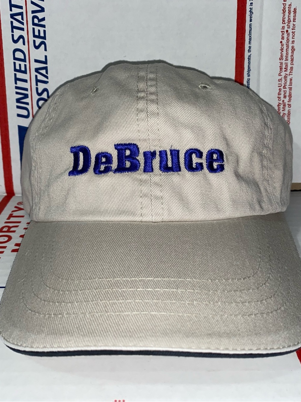 DeBruce Embroidered Baseball Cap dad hat Company Inc Corporation Surname Name ?